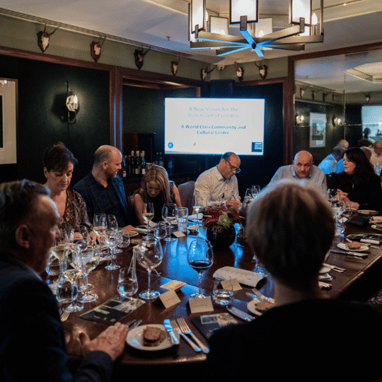 People sat round a table having a corporate meeting at Corrigan's Mayfair