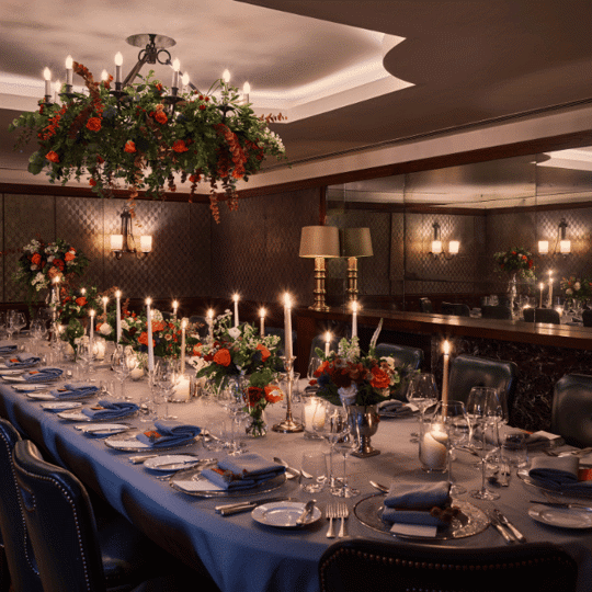 Table grandly laid with flowers and candles at Corrigan's Mayfair